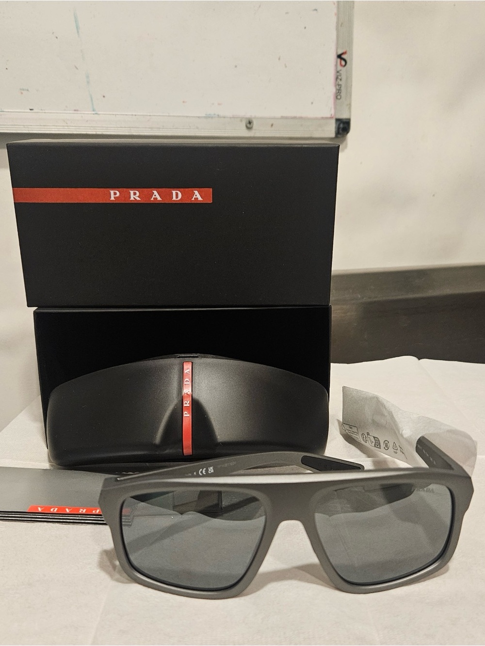 Prada Grey Sunglasses with Red Detail